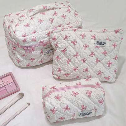 1个粉色蝴蝶结绗缝化妆包，休闲大容量便携拉链化妆包，旅行度假必备，可收纳卫生巾、耳机、充电器、口红、化妆品、香水、护肤品、家居装饰