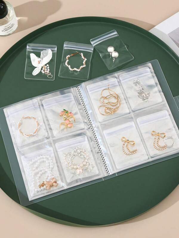 1 pièce Album de rangement de bijoux transparent givré avec 20/84 sacs de rangement anti-oxydation et anti-poussière, pour organiser les bagues, boucles d'oreilles, colliers et cosmétiques. Meilleur cadeau de fête, portable.