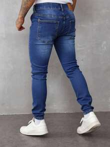 Pantalones vaqueros ajustados para hombre de color azul con detalles de roturas, tela transpirable y cómoda, ideales para estilos casuales urbanos - Azul lavado medio - Ver 3