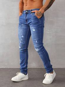 Pantalones vaqueros ajustados para hombre de color azul claro con roturas y detalles de pintura, estilo casual y artístico - Azul lavado medio - Ver 2