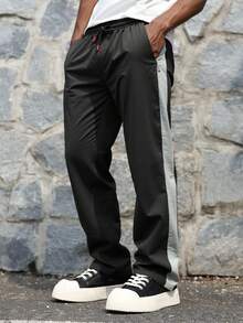 男士休闲运动宽松户外裤，彩色拼布，拉链口袋，尼龙面料，适合户外休闲运动 - 黑色 - 查看 2