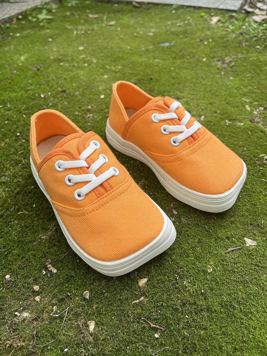1 双橙色帆布系带平底时尚活泼校园风格舒适透气休闲运动鞋，适合学生日常户外活动（随机）