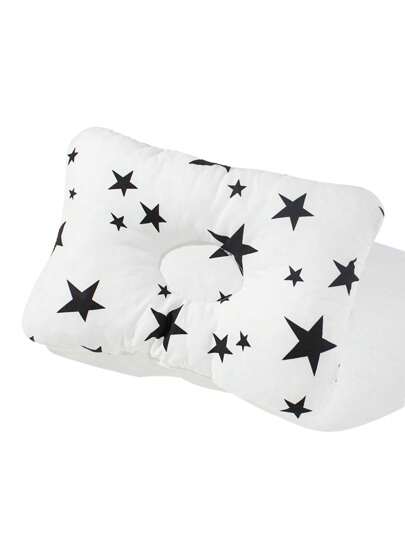A Baby Shaping Pillow With Star Prints