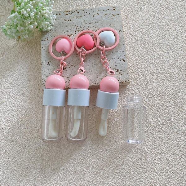 1 PIEZA Tubo de brillo de labios vacío rosa y blanco de 4ml con tapa de bola linda, con llavero y colgante con forma de corazón