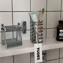 1 pièce Porte-brosse à dents en acier inoxydable, Porte-brosse à dents avec égouttoir, Support de conception à ressort créative, Organisateur de décoration minimaliste, Porte-pinceau de maquillage, Organisateur d'ustensiles de cuisine, Boîte de rangement multifonction pour la maison