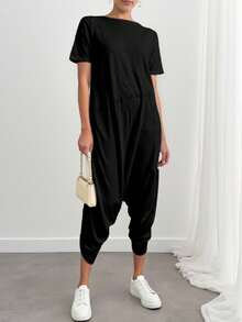 Enterizo mono jumpsuit mujer dama  manga corta cuello redondo corte relajado color lila bolsillos laterales tejido suave cómodo estilo casual moderno versátil para uso diario    Bolsillo  aberturas - Negro - Ver 2