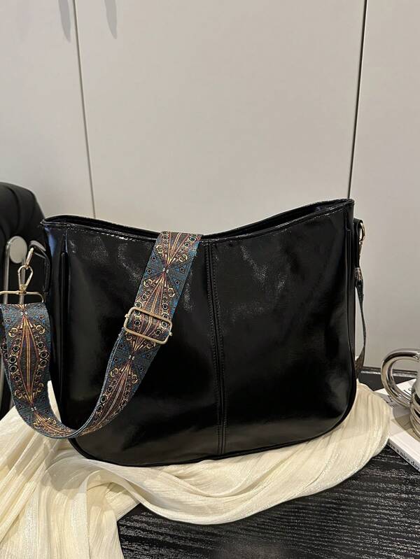 Uma Bolsa Transversal Estilosa Minimalista de Óleo e Cera para Mulheres com Alça de Ombro Contrastante, um acessório versátil com uma carteira de grande capacidade