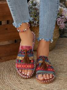 Sandalias planas sin cordones para mujer, de paja trenzada, con suela blanda, puntera abierta y borlas, estilo bohemio para la playa