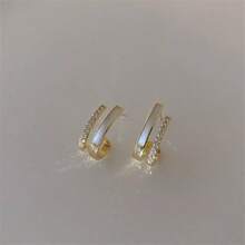 1 par de brincos de zircônia com duas garras, versáteis e minimalistas, elegantes e com clipe