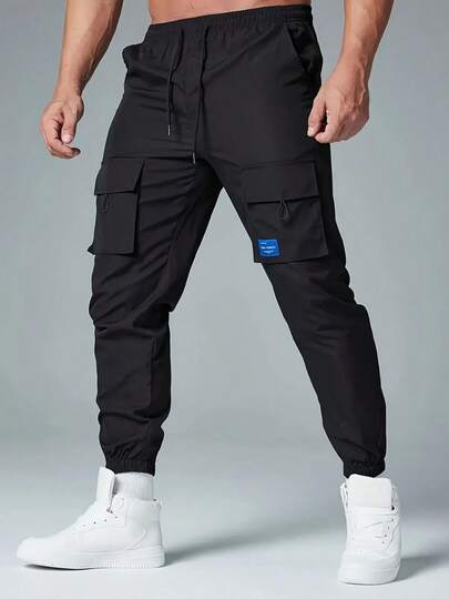 Pantalones casuales multibolsillos con cordón en color sólido para hombre