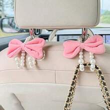 Bộ 2 móc treo túi xách ô tô hình nơ xinh xắn, đính ngọc trai trang nhã, móc treo đồ phía sau ghế xe hơi, móc treo túi xách tiện dụng gắn trên tựa đầu, phụ kiện trang trí xe hơi. - Nhiều màu - Xem 6