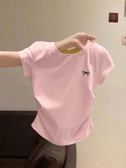 Camiseta de niña con cuello redondo ajustada, plisada y bordada con lazo, blusa casual y versátil para niños de talla media a grande