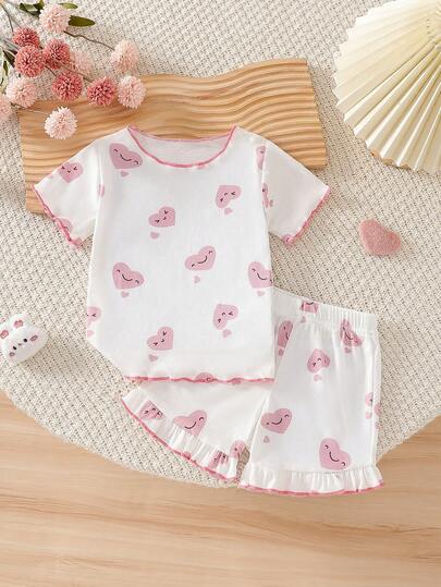 Set de 2 piezas para bebé niña con top con patrón de corazones lindos y shorts con dobladillo de volantes (adecuado para usar en casa)