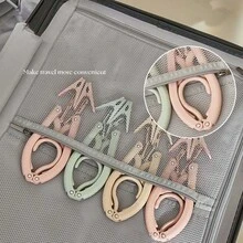 Cuier pliabil ultraportabil pentru haine, pentru călătorii și uz casnic - Organizator de haine ușor, care economisește spațiu, cu brațe reglabile, design pliabil, construcție durabilă din oțel, cârlige cu prindere rapidă, accesorii versatile pentru dulap, spălătorie, cămin, camping și escapade de weekend; Suport compact, pliabil, care maximizează spațiul din dulap - Multicolor - Vizualizare 3