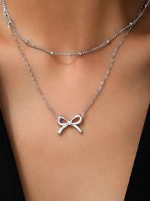 1 colar com pingente de laço minimalista e luxuoso de aço inoxidável, design de gargantilha em camadas, adequado para mulheres, uso diário ou eventos importantes, ótimo presente para namorada/melhor amiga (sem caixa de presente)