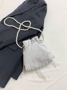 Chiếc túi đeo chéo thời trang và thanh lịch dành cho nữ này được làm từ vải polyester, trang trí bằng nơ, có dây rút và dây đeo dạng chuỗi hạt, phù hợp cho các dịp như tiệc chiêu đãi, liên hoan và đám cưới. - trắng - Xem 9