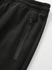 Quần thể thao mùa hè nhẹ dành cho nam cỡ lớn - Quần chạy bộ và tập luyện thoáng khí với túi khóa kéo, dáng vừa vặn, có thể giặt máy, màu trơn, thích hợp cho hoạt động thể thao ngoài trời và mặc thường ngày, trang phục thể thao tiện dụng, cạp chun co giãn thoải mái, dây rút điều chỉnh, cỡ XL, màu đen, mùa xuân. - màu đen - Xem 7