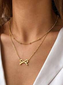 1 colar com pingente de laço minimalista e luxuoso de aço inoxidável, design de gargantilha em camadas, adequado para mulheres, uso diário ou eventos importantes, ótimo presente para namorada/melhor amiga (sem caixa de presente)