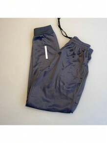 MEN'S SPORTY JOGGER PANTS WITH REFLECTIVE SYMBOL THAT SHINES IN -