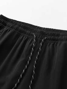 Quần thể thao mùa hè nhẹ dành cho nam cỡ lớn - Quần chạy bộ và tập luyện thoáng khí với túi khóa kéo, dáng vừa vặn, có thể giặt máy, màu trơn, thích hợp cho hoạt động thể thao ngoài trời và mặc thường ngày, trang phục thể thao tiện dụng, cạp chun co giãn thoải mái, dây rút điều chỉnh, cỡ XL, màu đen, mùa xuân. - màu đen - Xem 4