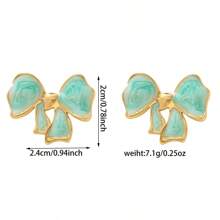 1 paire de boucles d'oreilles florales exquises à effet d'écoulement d'huile, clous d'oreilles élégants, uniques et délicats, de luxe. Bijoux de tempérament doux.