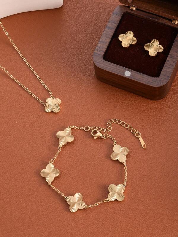 Un ensemble de 3 pièces incluant un collier, un bracelet et des boucles d'oreilles en métal minimaliste à la mode européenne avec un motif de trèfle ajouré. Un collier avec un pendentif fleur porte-bonheur idéal pour les fêtes, les vacances. Accessoires à offrir en cadeau à sa petite amie.