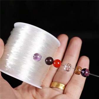 φ1mm x 80m hoogwaardige transparante vislijn, elastische lijn, kristallen lijn, doe-het-zelf elastisch touw met kralen, sieraden met kralen, zwart elastisch touw - diameter 1 mm, lengte 3149,61 inch, zeer elastisch en duurzaam touw, geschikt voor het maken van sieraden, armbanden, rozenkransen, kettingen, handwerk en doe-het-zelfprojecten