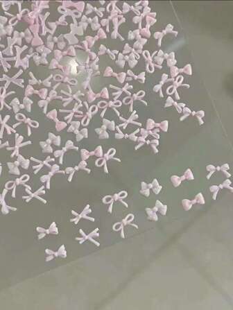 50 piezas Conjunto de decoraciones de arte de uñas con lazos rosas, incluye mini lazos y cintas, adecuado para uso de niñas DIY, se puede usar como accesorios de arte de uñas, decoraciones de uñas y gemas para uñas.