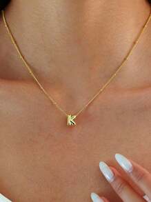 A Novel And Fashionable, Exquisite Copper Pendant Necklace With The English Letters "A-Z" Engraved On It And Featuring A Hole Design. It Is An Excellent Choice For Gift-Giving On Special Occasions And Also Suitable For Women To Wear Daily, For Casual Occasions.