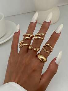 6pcs/Set Vintage Minimalist Alloy Molten Lava Teardrop Design Open Rings, Asymmetrical Fashionable Thick Metal Gold Tone Ring Set, Irregular Drops Of Liquid Metal Drape Over The Ring, Its Surface Replicating The Etched Texture Of Waves, With A Cold Sea Spray Luster On The Electroplated Silver Background. The Glazed Droplets Are Embedded With A Bubble Pattern, A Blue And White Gradient That Resembles The Crashing Waves Of The , And A Crescent-Shaped Indentation Hidden In The Ring's Opening And Closing Points. When The Fingertip Shakes, The Cut Surface Reflects The Shimmering Waves, As If Wearing The Instantly Frozen Waves On The Finger, The Gentle And Rigid Design Allows A Sense Of Niche And A Sense Of Art To Coexist.Suitable For Women's Daily Commute,Perfect Gift For Birthdays, Holiday Gifts, And Parties. Suitable For Daily Wear And Holiday Celebrations, Suitable For All Seasons, And Is An Ideal Choice For Holiday Accessories. - Vàng - Xem 2