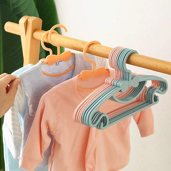 20-Pack Durable Kids Clothes Hangers With Cute Bows | Plastic Hangers For Newborns, Toddlers & Children, Pastel Colors (Pink, Blue, White) - Compact Space-Saving Design For Wardrobe Organization - Elegant Gift For Holidays, Birthdays, Home.