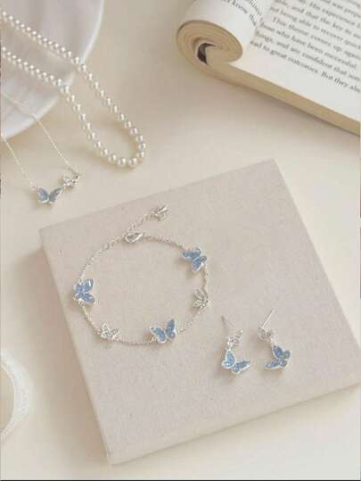 Juego de joyería de 1 pieza/2 piezas/5 piezas con collar, pulsera, pendientes y anillo con mariposa asimétrica de cristal azul y perla artificial. Gran regalo para días festivos para novia/mejor amiga