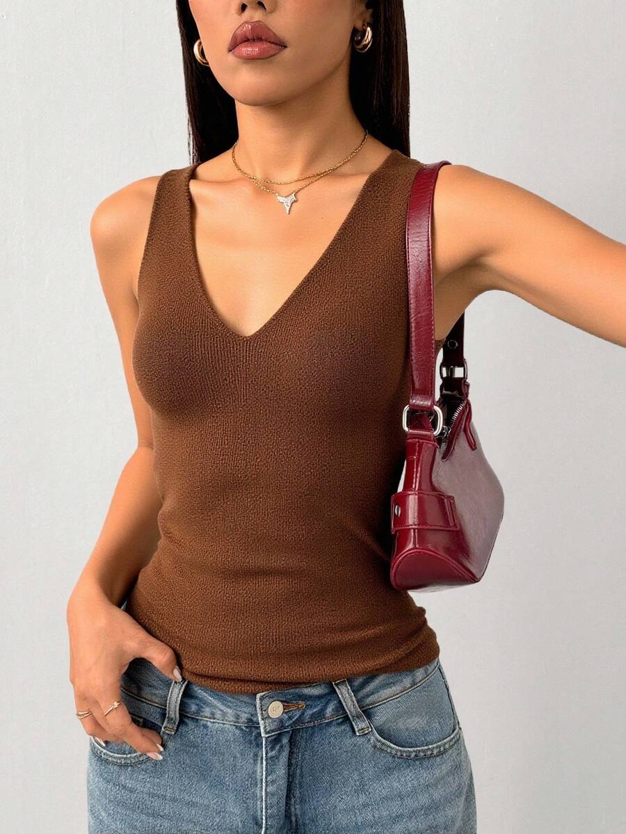 Gładka, swobodna dzianinowa bluzka z kieszenią na guziki i zamkiem błyskawicznym