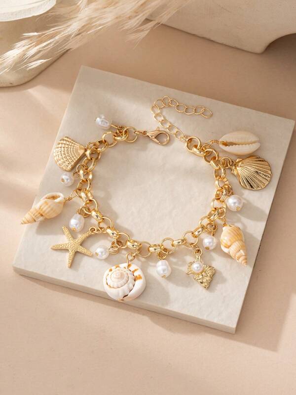 bracelet à breloques étoile de mer, coquillage et perles, thème océan, pendentif multicouche à la mode, idéal pour les femmes, les fêtes sur la plage ou les vacances (article fait main, la couleur et la taille peuvent varier légèrement).