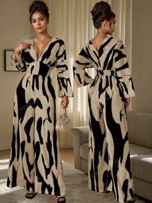 Mono estampado asimétrico elegante y de moda para mujer, versión suelta, temperamento de moda y adelgazamiento, pantalones anchos y drapeados elegantes de alta gama, estilo europeo y americano para modificar la forma del cuerpo.