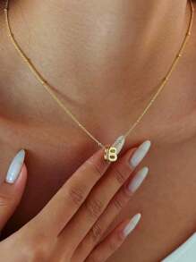 A Novel And Fashionable, Exquisite Copper Pendant Necklace With The English Letters "A-Z" Engraved On It And Featuring A Hole Design. It Is An Excellent Choice For Gift-Giving On Special Occasions And Also Suitable For Women To Wear Daily, For Casual Occasions.