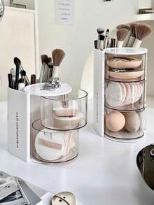 1 pièce Boîte de rangement 2-en-1 pour éponge et houppette de maquillage rotative, organisateur de bureau de coiffeuse élégant et anti-poussière pour éponges de maquillage, coussinets, rouges à lèvres et pinceaux de maquillage. Parfait pour les passionnés de beauté et les professionnels. Cadeau idéal pour les fêtes et les occasions spéciales. Améliorez votre routine de maquillage avec cet organisateur chic et fonctionnel. - Boîte de rangement multicolore - Voir 4