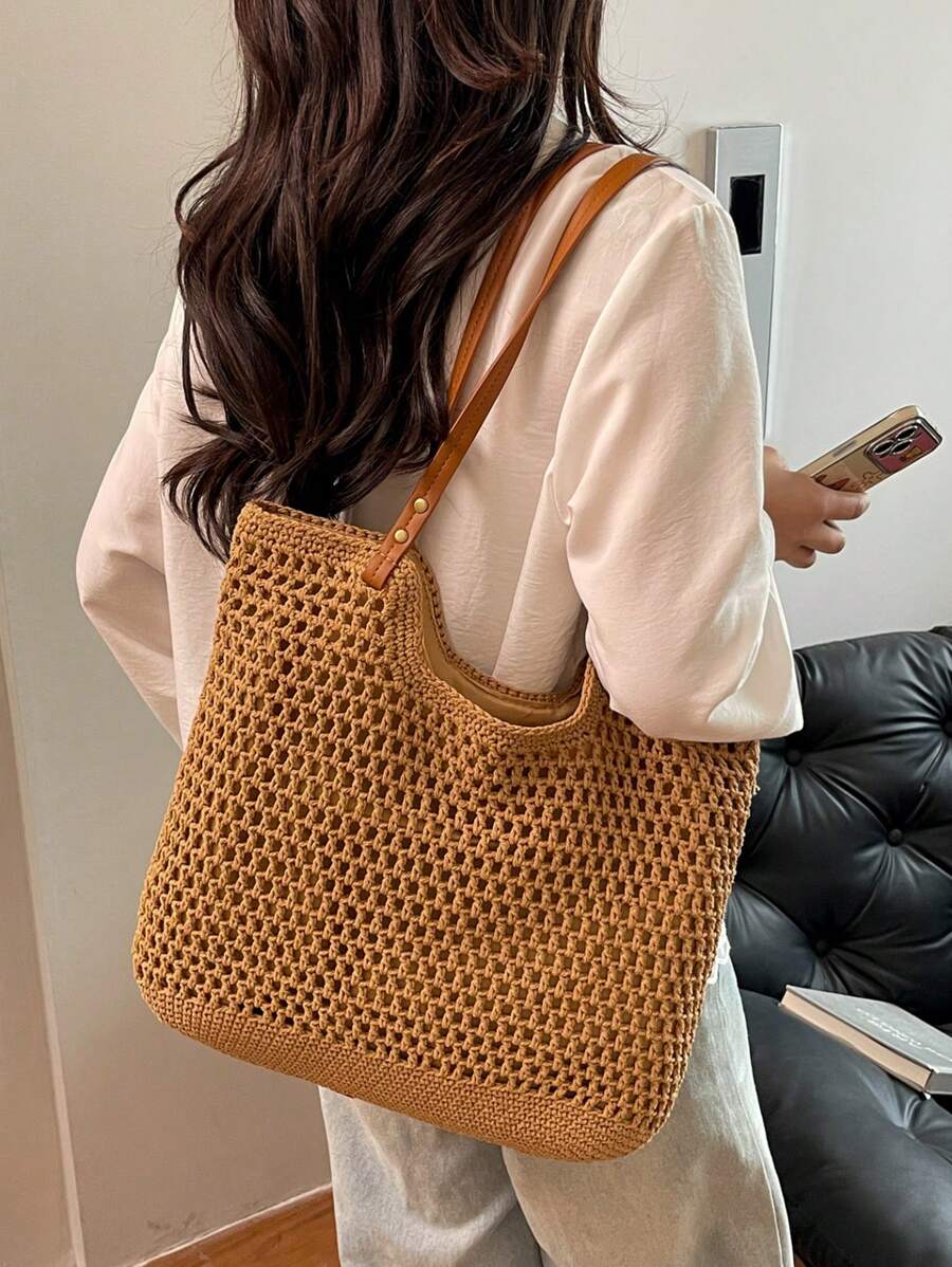 Sac à main de style vacances bord de mer à la mode et polyvalent avec un design ajouré grande capacité, léger et portable, style de sac de plage. Sac à bandoulière à double poignée, un sac de voyage indispensable, convient pour les vacances au bord de et les voyages.