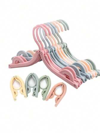 1/2 Piezas Perchas de ropa plegables, perchas de viaje ligeras con diseño plegable, perchas de plástico portátiles adecuadas para viajes y hogar, disponibles en varios colores, fácil de organizar, perchas plegables durables y compactas, ideales para espacios pequeños y para llevar, perfectas para camisas, pantalones y vestidos.