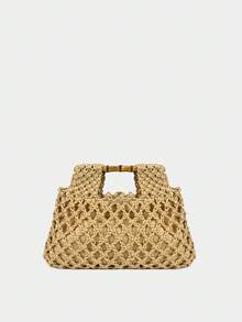 手工制作的纯色手提包，采用镂空设计和竹制手柄，容量大