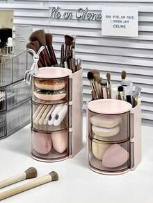 1 pièce Boîte de rangement 2-en-1 pour éponge et houppette de maquillage rotative, organisateur de bureau de coiffeuse élégant et anti-poussière pour éponges de maquillage, coussinets, rouges à lèvres et pinceaux de maquillage. Parfait pour les passionnés de beauté et les professionnels. Cadeau idéal pour les fêtes et les occasions spéciales. Améliorez votre routine de maquillage avec cet organisateur chic et fonctionnel. - Boîte de rangement multicolore - Voir 5