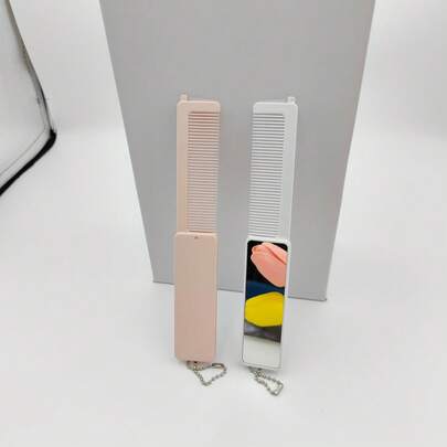 二合一折叠式梳子兼化妆镜，ABS塑料材质，小巧便携，旅行必备，粉色和白色可选