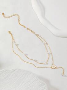A Double Layered Pearl And Flower Y-Shaped Necklace For Women