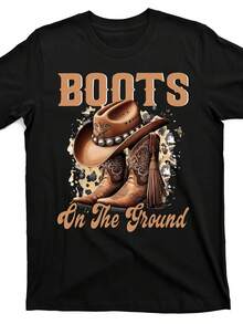 Camiseta gráfica de botas de vaquero occidentales para hombres - Camiseta vintage "Botas en el suelo" con diseño de sombrero de vaquero - Camisa de algodón negra para festivales de música country, fiestas en ranchos y ropa casual de calle - Atuendo de verano transpirable, atuendo de fiesta en rancho, estilo de tipografía audaz, construcción duradera - Negro - Ver 1