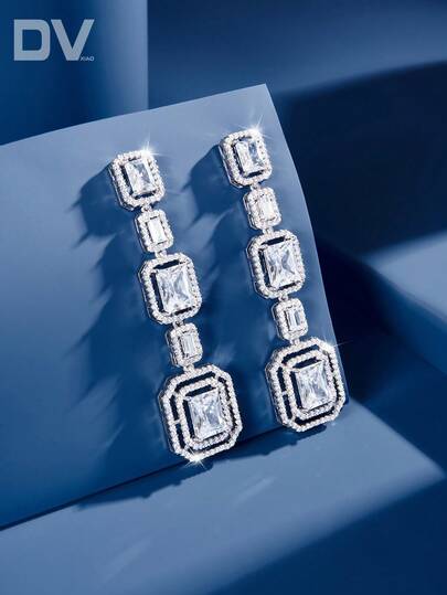 DV JEWELRY 1 par de Pendientes de lujo de mujer con colgante artificial de circonio cúbico chapado en oro blanco, joyería impresionante para citas, bodas, fiestas y aniversarios, con caja de regalo