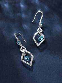 1 paire de boucles d'oreilles élégantes et à la mode avec zircone bleue et gland tourbillonnant. Convient pour le port quotidien, les fêtes et les voyages des femmes. Cadeau de bijoux pour la petite amie, à porter en rendez-vous