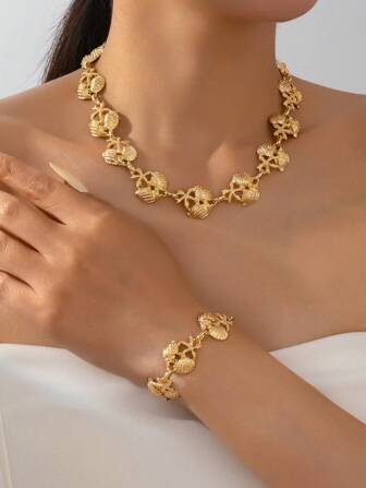 1 set de bijoux pour femmes, collier et bracelet avec décoration d'étoile de mer et de coquillage dorés, ambiance marine fantaisiste, ludique et élégante, parfait pour ajouter un charme estival en toute saison