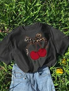 T-shirt estiva casual a girocollo con stampa, adatta per ragazze e bambini - T-shirt con stampa leopardata, fiocco, stile artistico a ciliegie, che ispira immaginazione ed espressione di sé! Abbigliamento per bambini, maglietta grafica per ragazze, top estivo, moda per adolescenti - Grigio Scuro - Visualizzare 1