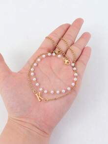 Bộ 2 món phong cách tối giản gồm dây chuyền mặt chữ, dây chuyền thép không gỉ mạ vàng và vòng tay ngọc trai giả, dành cho nữ. - Vàng - Xem 3