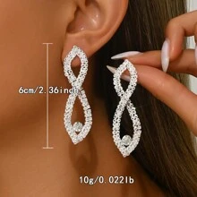 1 par de pendientes colgantes ovalados y huecos con cristales, estilo europeo y americano, para combinar con vestidos formales para mujer